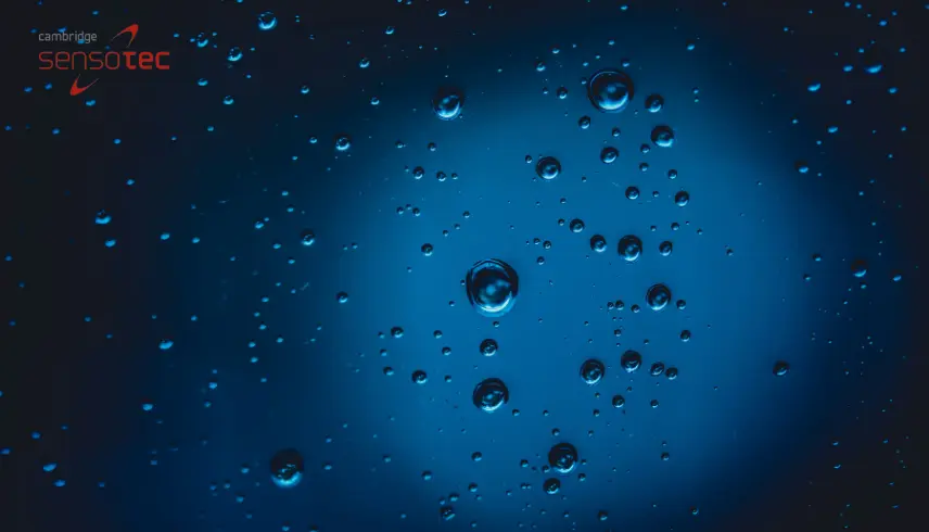 Water drips on a blue background.